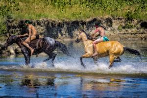 Indian Warriors Crossing Little Bighorn River